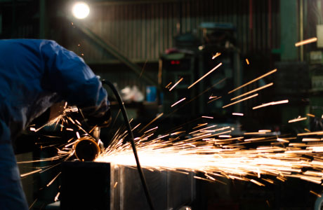 Image of young welding technician working